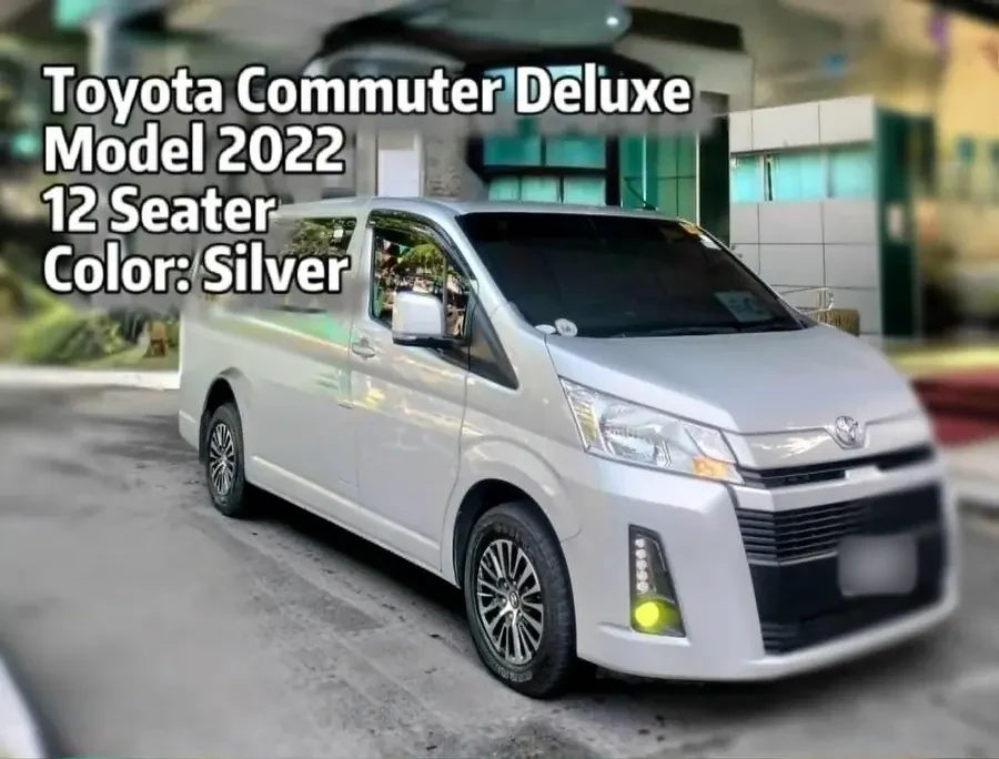 Silver 2022 Toyota Commuter Deluxe twelve-seater van parked outside a building